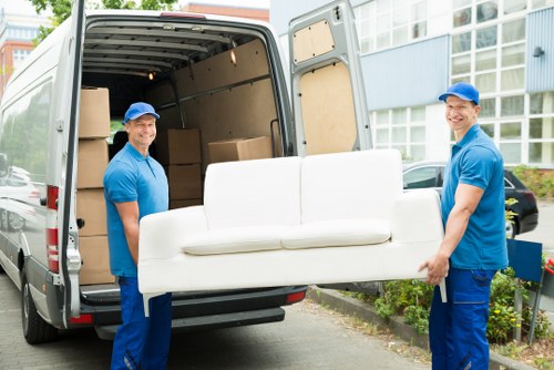 Removal team planning a home move in Merton with boxes and furniture