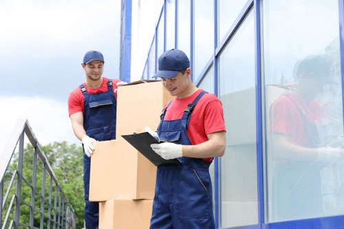House removals team preparing a moving van for a home move in Merton