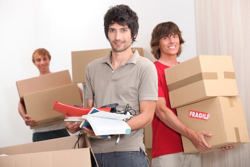 Packing and labelling items for an office move in Merton