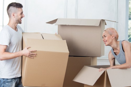 Loading furniture and boxes into a van for a Merton move