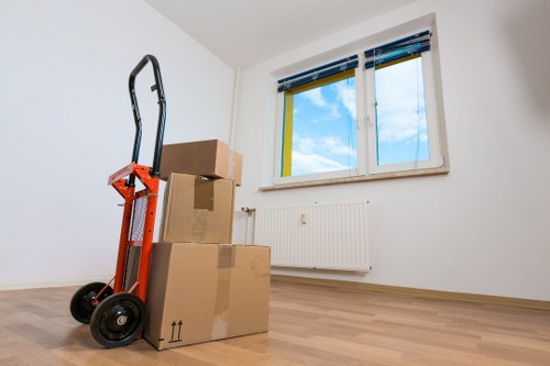 Loading furniture into a removal truck on a residential street