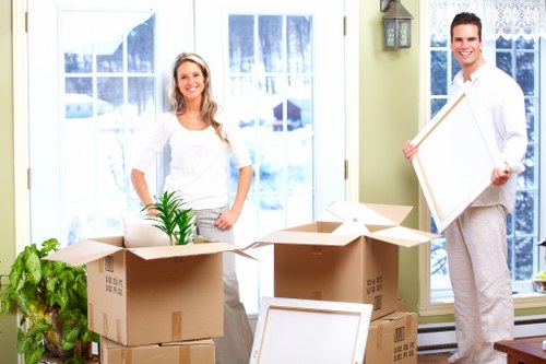 Careful loading of furniture into a moving van for a Merton job