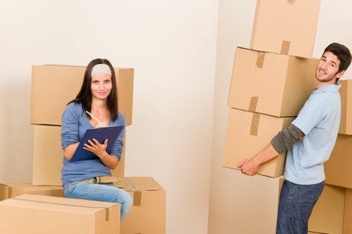 Packed household boxes and furniture ready for transport in Merton